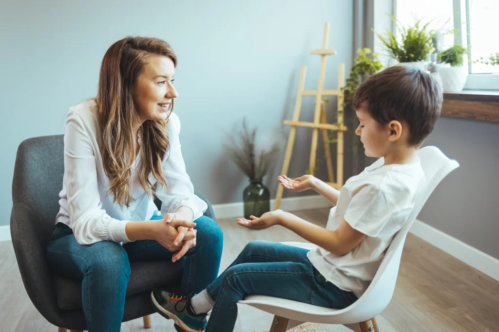 Contact worker and parent in supportive conversation during child contact session at Truevale Care Portsmouth centre